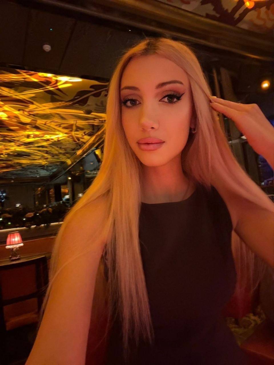 beautiful blonde woman portrait in elegant restaurant