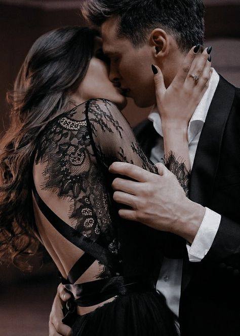 Romantic couple embracing in elegant evening attire during an intimate moment